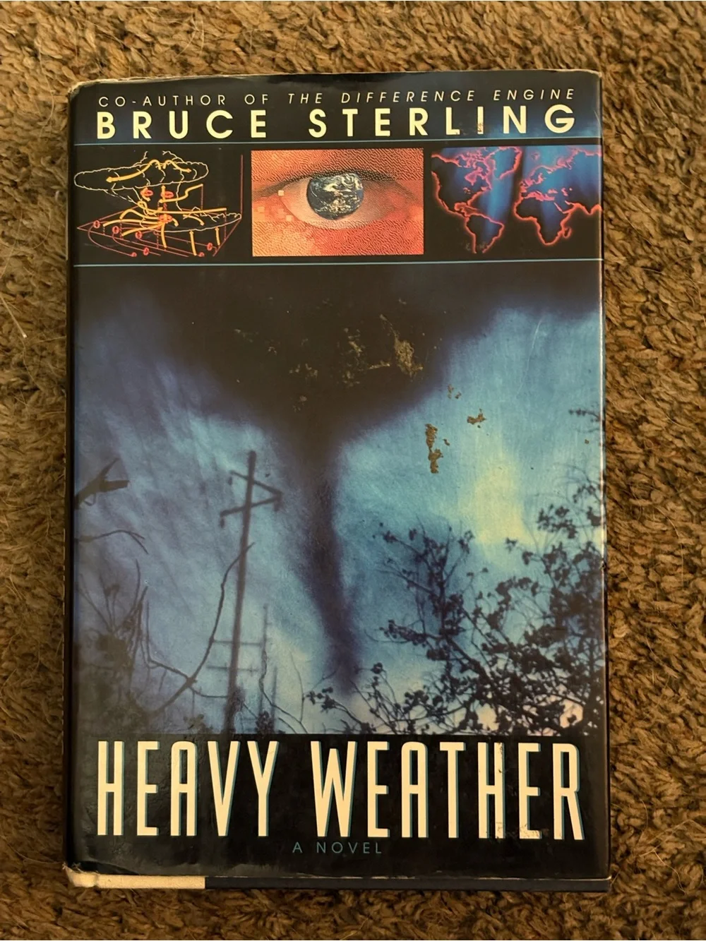 Heavy Weather by Bruce Sterling - The Suspect by John Lescroart. GUC.